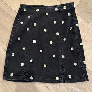 Black Jean skirt with embroidered daisy flowers